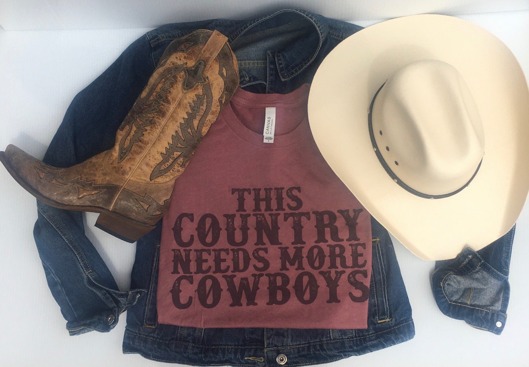 Rockledge Design Co. Mauve This Country Needs More Cowboys Ladies Tee TCNMC-MAV