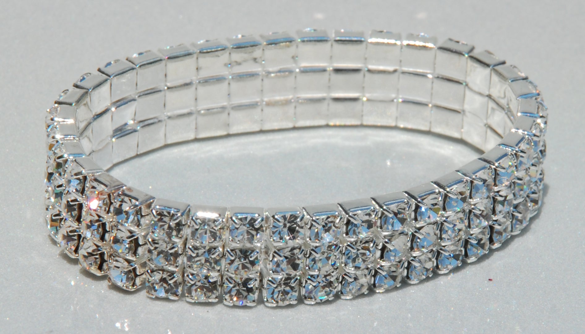 J-156 3 Row Clear Rhinestone Stretch Bracelet.